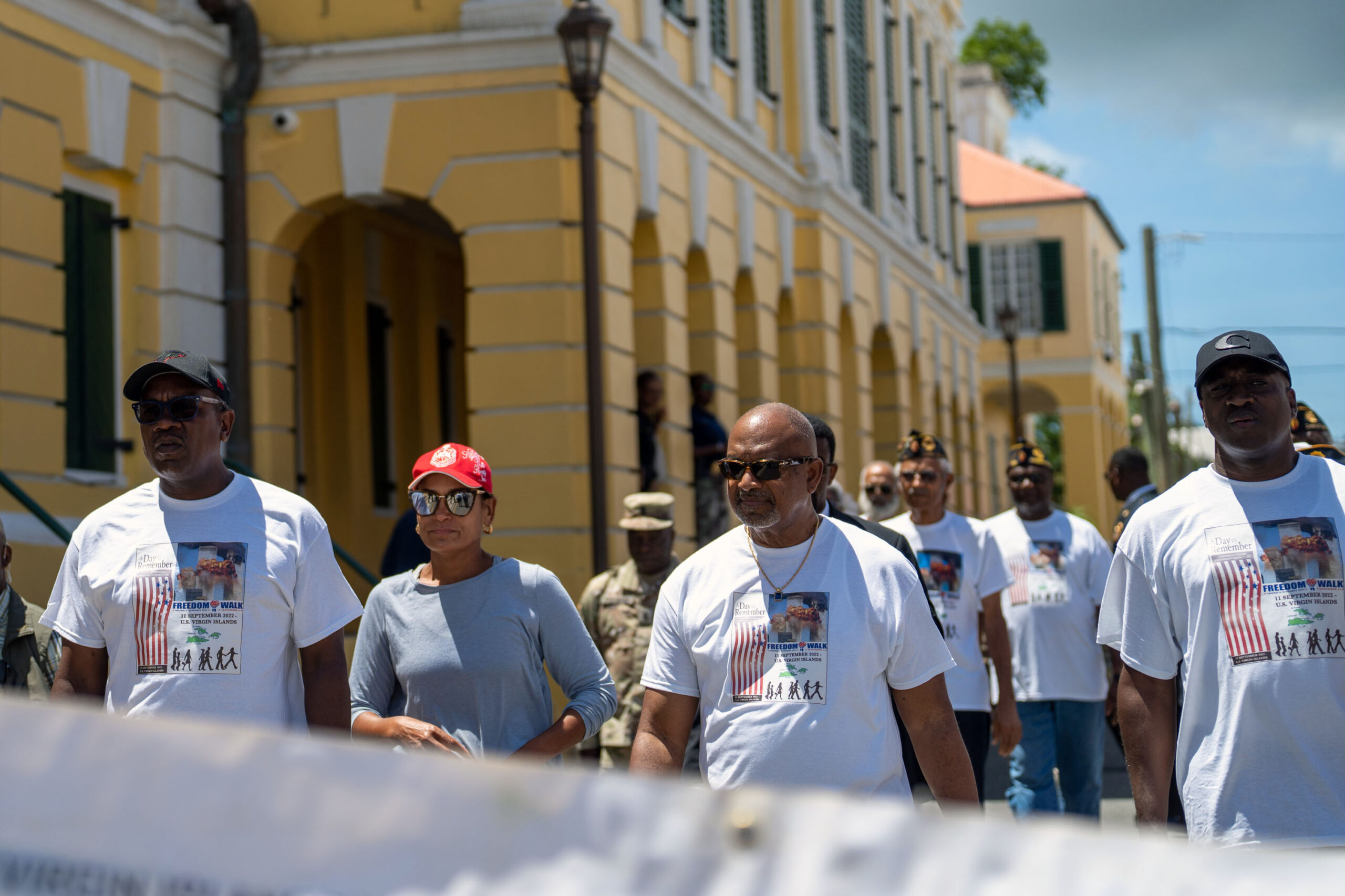 Gov. Albert Bryan Jr., First Lady Yolanda Bryan, and Lt. Gov. Tregenza Roach, from left, participate in a Patriot Day parade on Sunday in Christiansted, St. Croix. (Government House photo)