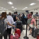 assengers queueing to check bags