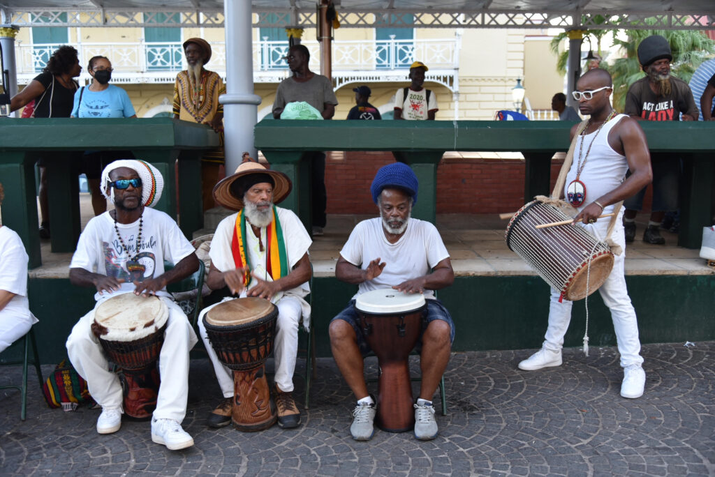 Drummers Earl "Jahbo" Demming, Delroy "Ital" Anthony, Andre Malone, and Malachi Thomas perform as part of the commemoration of the Coal Workers' Strike of 1892. (Conch Shell Media, LLC Photo)