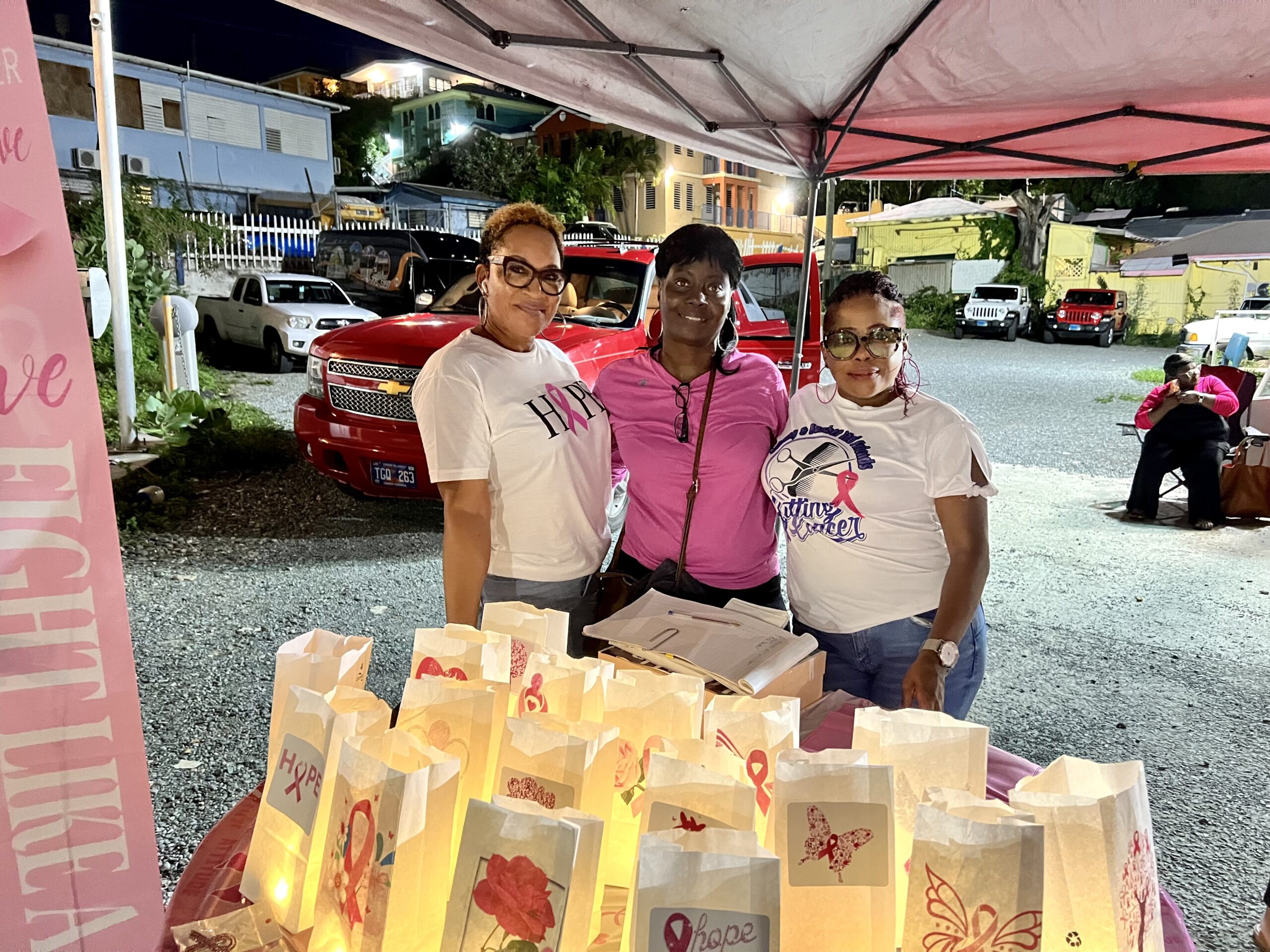 Myrtle Penn, Yvette Stapleton, and Shani Carbon sell luminaries to Light Up the Night against cancer. (Photo by Amy H. Roberts)