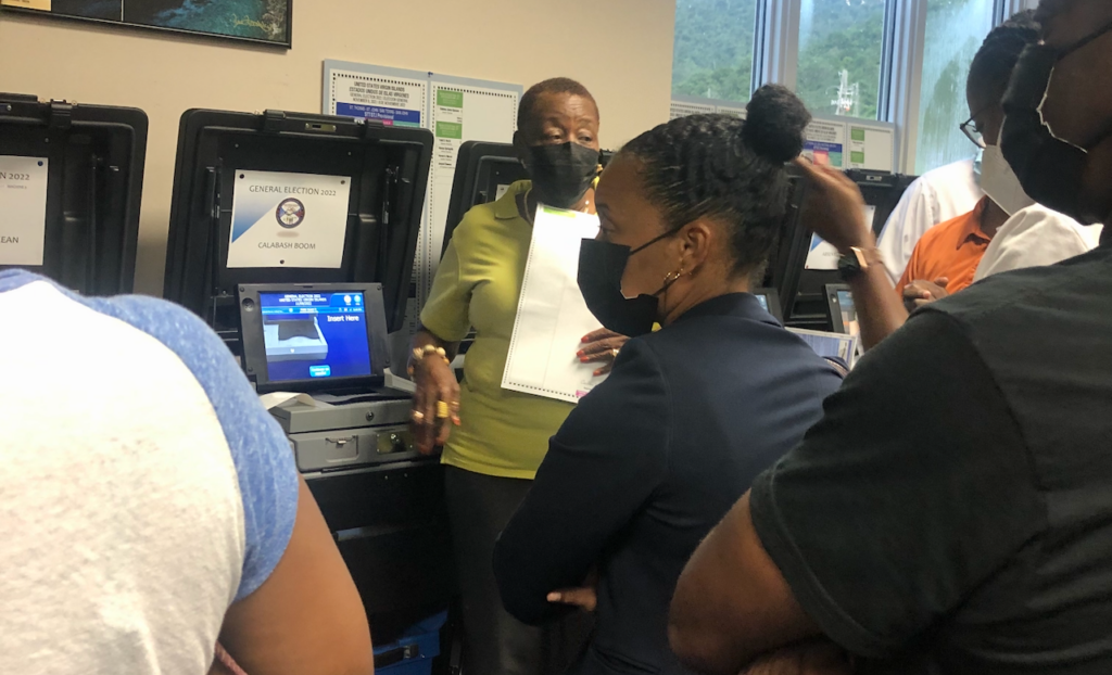 Elections Board Member Alecia Wells explains the process of testing voting machines to a gathering at the Elections System office on St. Thomas on Wednesday. (Photo by Judi Shimel)