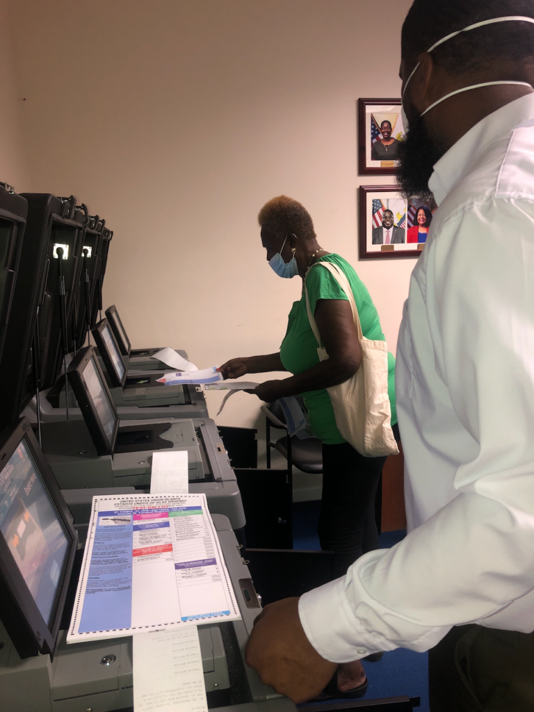 Election technician LeSean Moses and Board Member Hendricks test another array of voting machines on Wednesday. Moses said before the process is completed, every machine and vote tabulator would be checked to make sure they worked properly. (Photo by Judi Shimel)