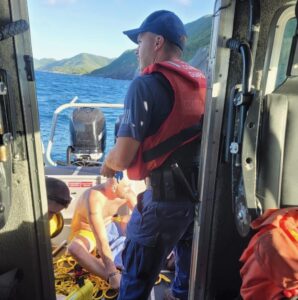 A Coast Guard 33-foot Special Purpose Craft crew from Boat Forces Detachment St. Croix rescues a missing snorkeler who was found stranded on the rocks off of Hams Bluff Lighthouse in St. Croix, U.S. Virgin Islands Nov. 29, 2022. (U.S. Coast Guard photo)