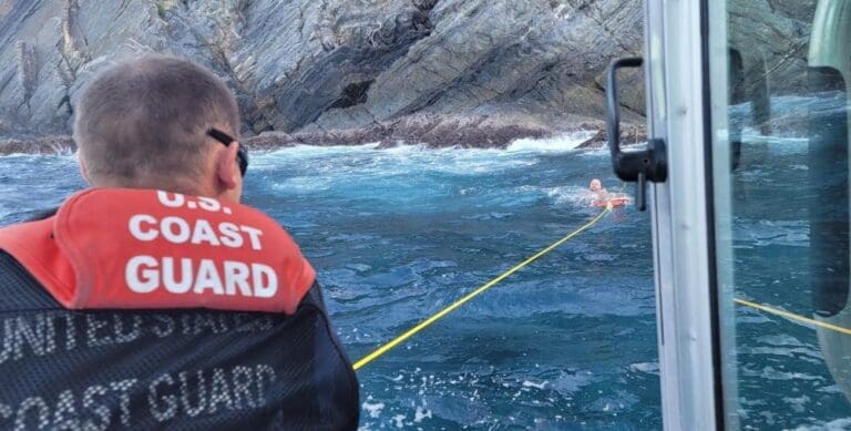 A Coast Guard crew from Boat Forces Detachment St. Croix rescues a missing snorkeler stranded on the rocks Tuesday at the Hamm's Bluff Lighthouse on St. Croix. (U.S. Coast Guard photo)