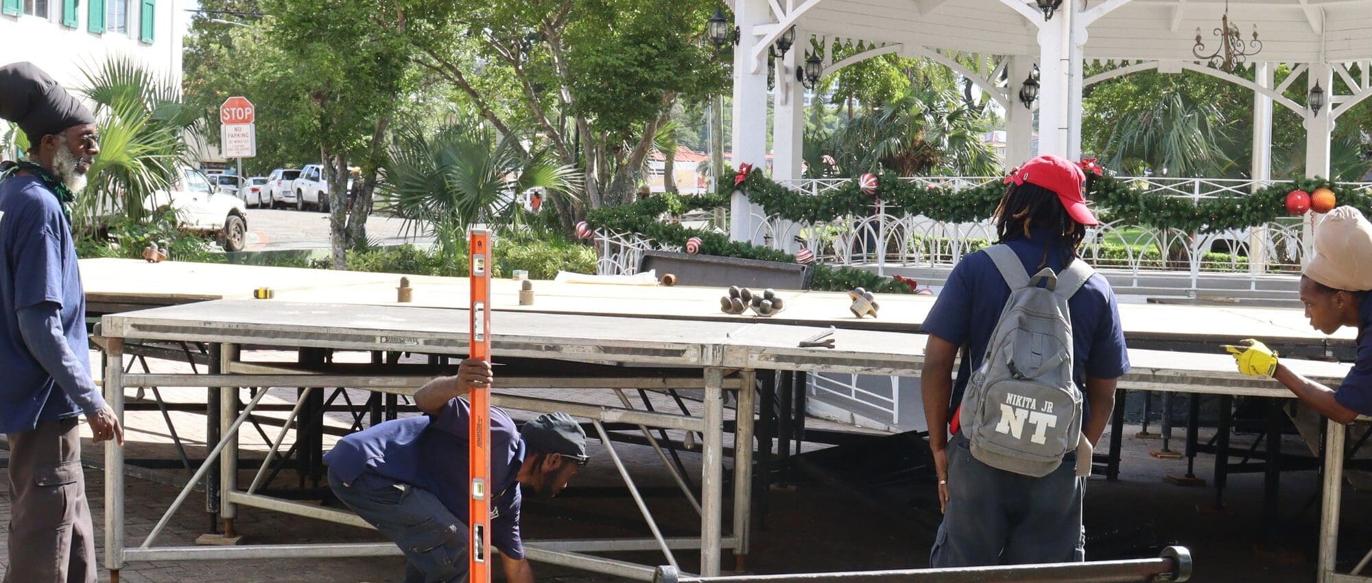 Public Works Department construction crews, with help from other agencies, work Friday to construct a stage for the swearing-in of Gov. Albert Bryan Jr. and Lt. Gov. Tregenza Roach to their second term in office on Monday at Emancipation Garden on St. Thomas. (Photo courtesy Public Works Department)