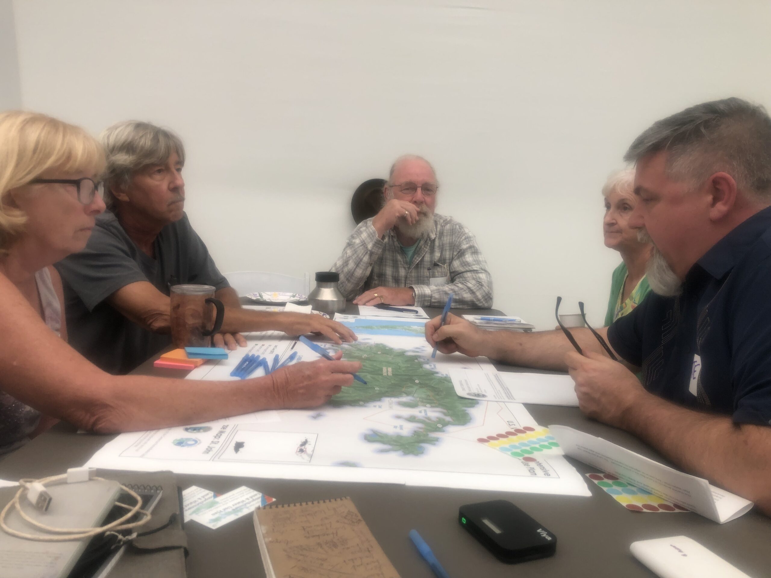 Nate Kelly, front right, guides St. John residents as they consider a comprehensive land and water use plan for St. John. (Source photo by Judi Shimel)