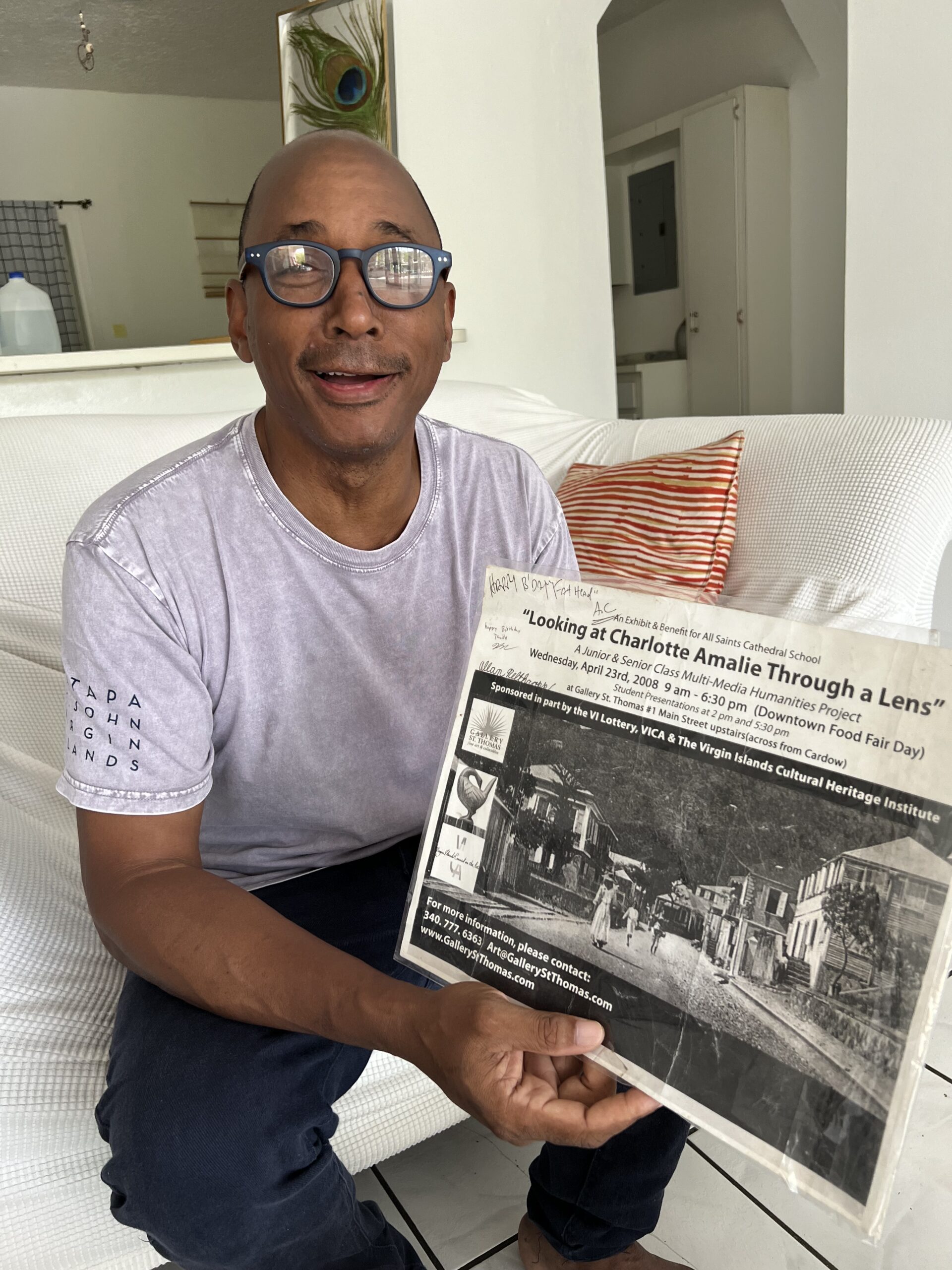 Aubrey “AC” Burgess holds a poster for one of his original art projects. (Photo by Amy H. Roberts)