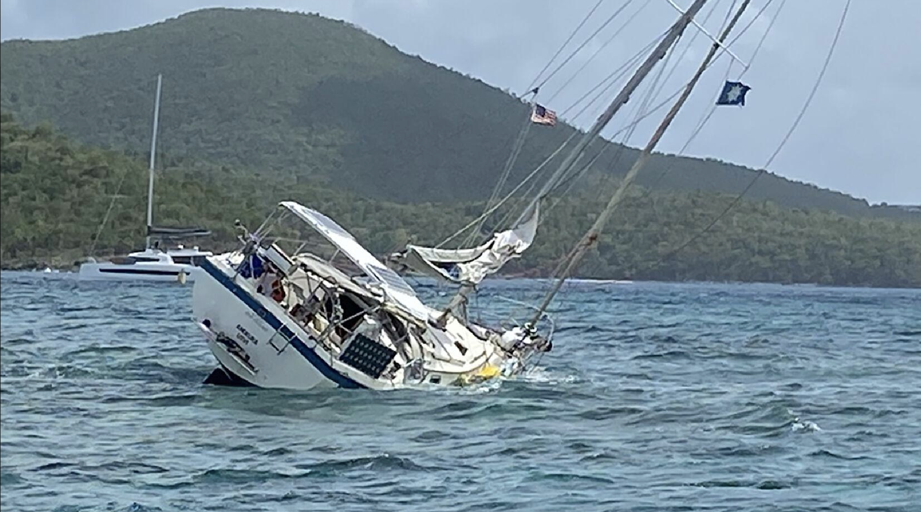 The 42-foot Amokura lists after grounding on July 7 at Johnson’s Reef off St. John. (Coast Guard photo)