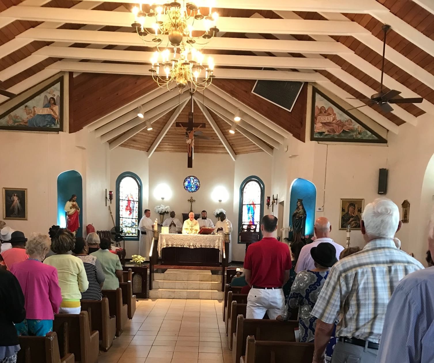 Members of the Order of Malta celebrate at the Lourdes in a Day Mass for the sick on Feb. 13 at Our Lady of Perpetual Help Church on St. Thomas. (Submitted photo)