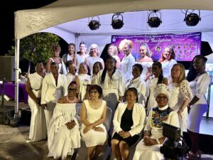 The evening’s women honorees adorned in white gather together. Featured honorees include, Naydyeyah Acoy-Thomas, professional master of ceremonies and marketing strategist, Casey Payton, Esq., executive director of Virgin Islands Justice Initiative, Meaghan Enright, executive director of Love City Strong Inc., Juanita Frett, owner of YUM VI catering services, A’Yana K. Phillips, owner of Lady Mix Entertainment, LLC., Kurell Sheridan, executive director at the Legislature of the Virgin Islands, Acia E. Brathwaite, owner of Y’Nobe hair studio, Ronessa Frederick, owner of Paradise Party Décor & Paradise Learning Academy, Sommer A. Sibilly-Brown, executive director at Virgin Islands Good Food Coalition, Deborah Hodge, police lieutenant and owner of Deb’z Flava, Amber Alexander, owner at Posh Boutique, Donna Frett-Gregory, senator at the Virgin Islands Legislature, Dionne R. Donadelle, territorial director of music at the Education Department, Andrea J. Dorsey, CEO of Blue Skies Empowerment Enterprises, Clema S. Lewis, executive director of the Women’s Coalition of St. Croix, Raynette A. Cameron Richards, founder of VI Ray of Sunshine Inc., Sophia del Rosario, president of EBM Academy of Cosmetology Inc., Anya Stuart, executive director of the Family Resource Center Inc. and Sandye A. Wilson, reverend and dean of All Saints Cathedral Church. (Source photo by Nyomi Gumbs)