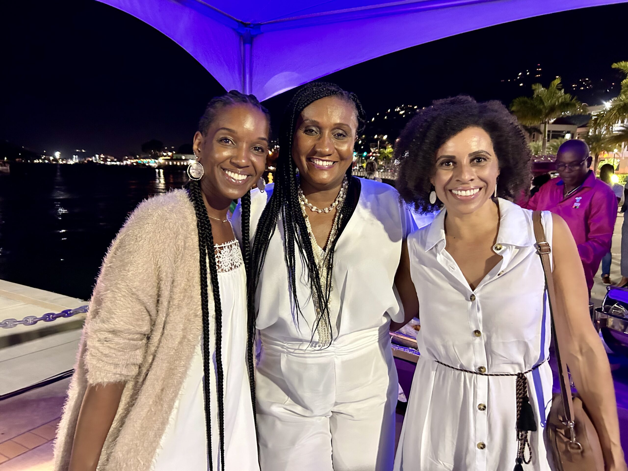Women business entrepreneurs Tamra James, general manager and senior research analyst at 13D Research & Strategy and Alli Bourne-Vanneck, owner of Calypso Media Productions and V.I. Tings’ celebrate with Sen. Donna Frett-Gregory at Friday’s event. (Photo by Nyomi Gumbs)