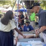 Sprauve student, Anjali Glenn and Bob Malacarne