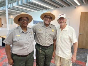 Esther Francis and Paul Jones, VINP concession specialists, pose with retired resource manager Rafe Boulon. (Source photo by Amy H. Roberts)
