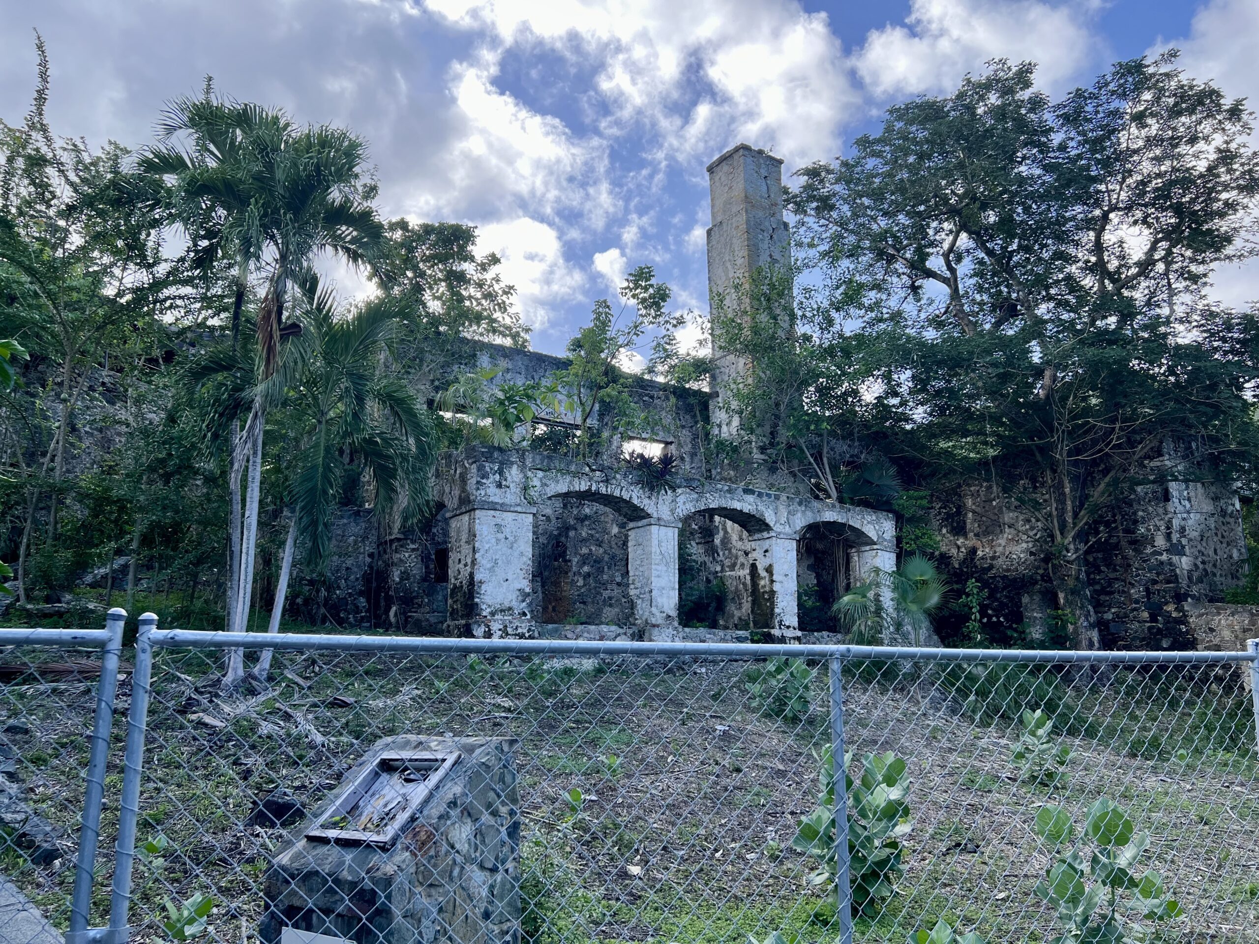 Visitors heading to the main beach at Caneel Bay pass by the impressive ruins of the sugar mill. (Source file photo)