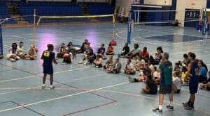 Gylton Da Matta talks to campers at volleyball camp. (Source photo by Mark J. Daniel)