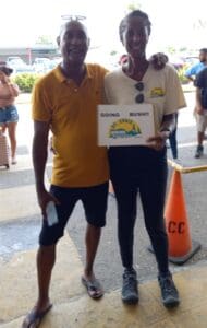 Nick Drayton and Cathy Prince welcome fellow members of the St. Croix Hiking Association outside the airport in Belize with a big sign that said, โGONE BUSH St. Croix Hiking Association." (Photo by Olasee Davis)