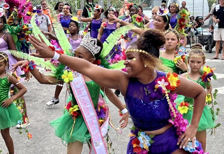 SJSA executive director Jeune’ Provost leads the school’s carnival troupe at the 2024 July 4th Celebration. (Source photo by Amy H. Roberts)