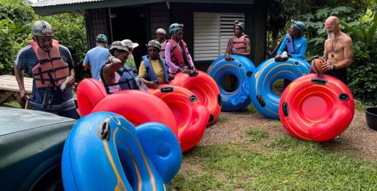 Members of the St. Croix Hiking Association get ready for river tubing at St. Herman’s Blue Hole National Park in Belize. The adventurous hikers went tubing through the cave's pitch-dark environment with headlights on their helmets. (Photo by Nick Drayton)