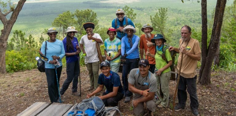 Members of the St. Croix Hiking Association and their guides after reaching the top of the Ni Witz hiking trail in southern Belize. (Photo by Rudy Saki)