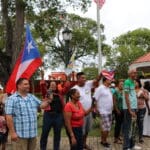 Fiesta en el Batey a cultural and family fun day in Buddhoe Park, kicked off the celebration in 2016. During the Fiesta, both the PR and VI flags were displayed in the crowd. (Source photo by Linda Morland)
