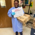 Annellie Gumbs from the VI Department of Health’s Epidemiology Division with mosquito dunks for distribution in dengue hotspot zones.