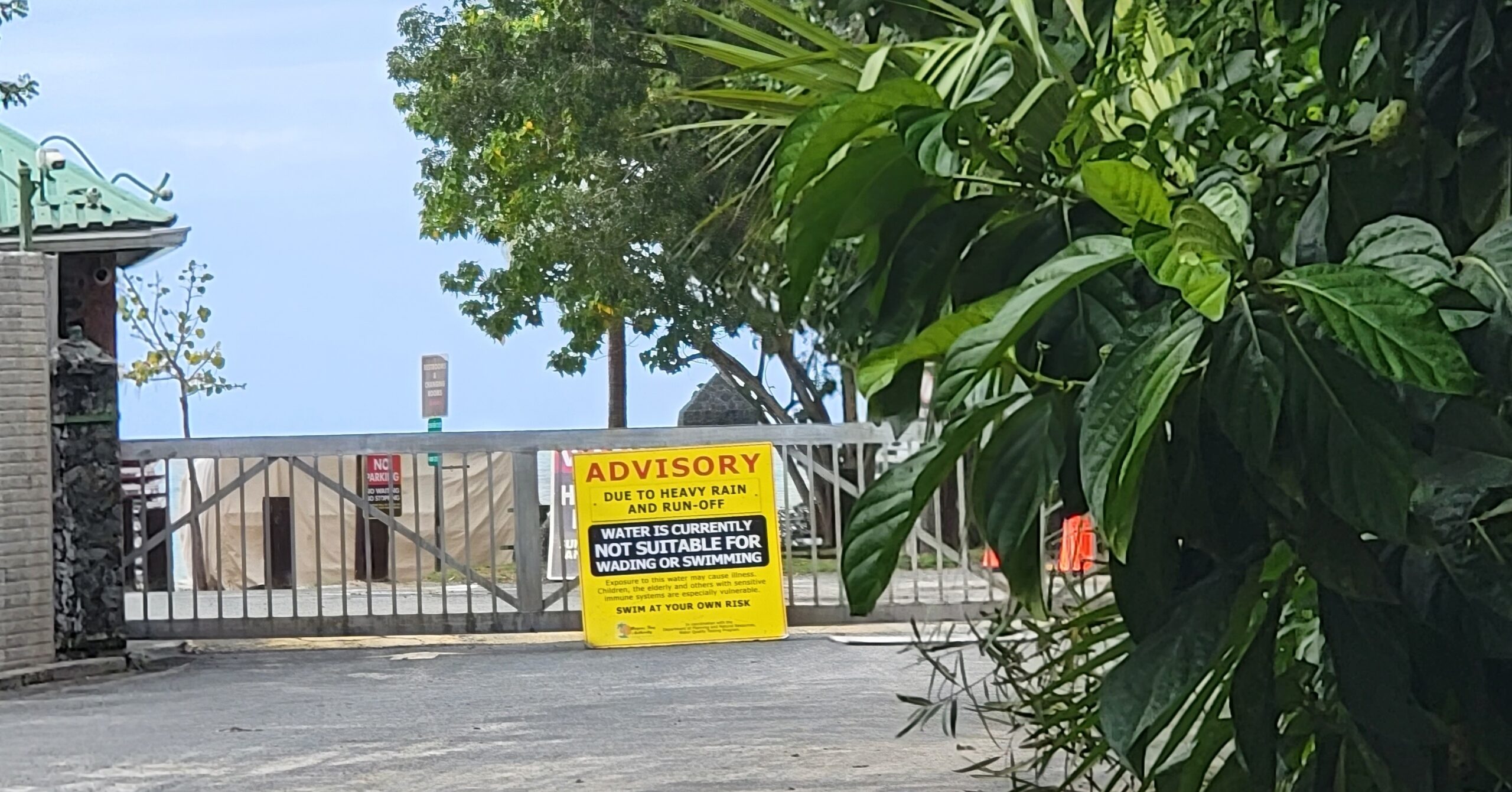 The gates to Magens Bay Beach on St. Thomas remained closed Friday after more than a week of heavy rain, with a sign warning that the water is not suitable for wading or swimming. (Submitted photo)