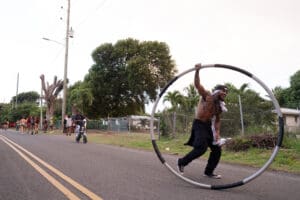 Antonio “Ringmasta” Cruz puts on a show for revelers at the start of the 72nd Crucian Christmas Festival J’ouvert on Thursday morning on St. Croix. (Source photo by Kit MacAvoy)