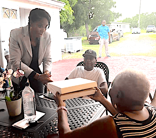 Plaskett Presents U.S. Flag to Raymond Williams and Family | St. Thomas