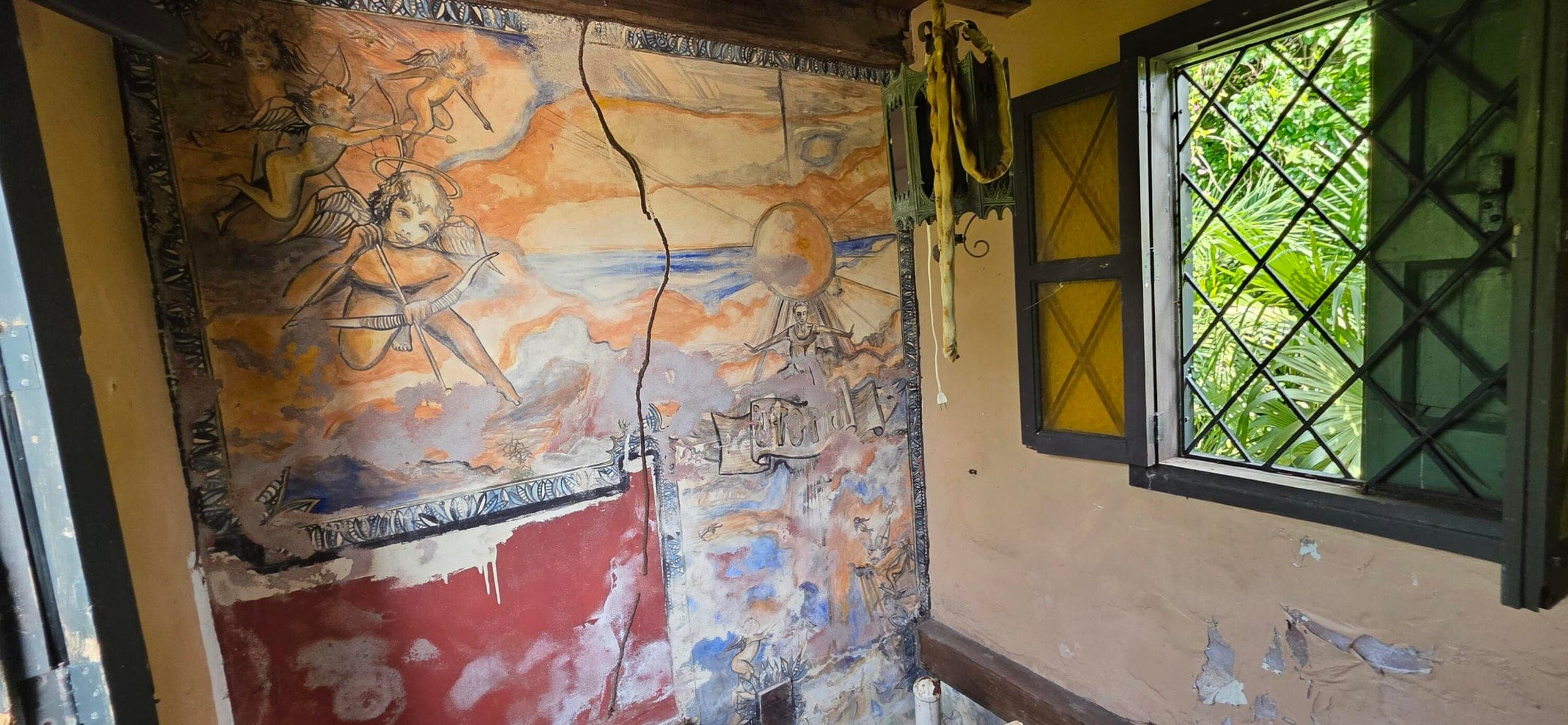 The mural stretches across several walls in a staircase. (Photo by Seaglass Properties)