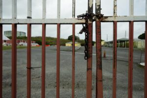 A lock keeps the entrance lane to St. Croix Central High School closed Monday morning. All public schools in the district closed after a bomb threat circulated widely on social media and a number of school monitors called in sick. (Source photo by Kit MacAvoy)