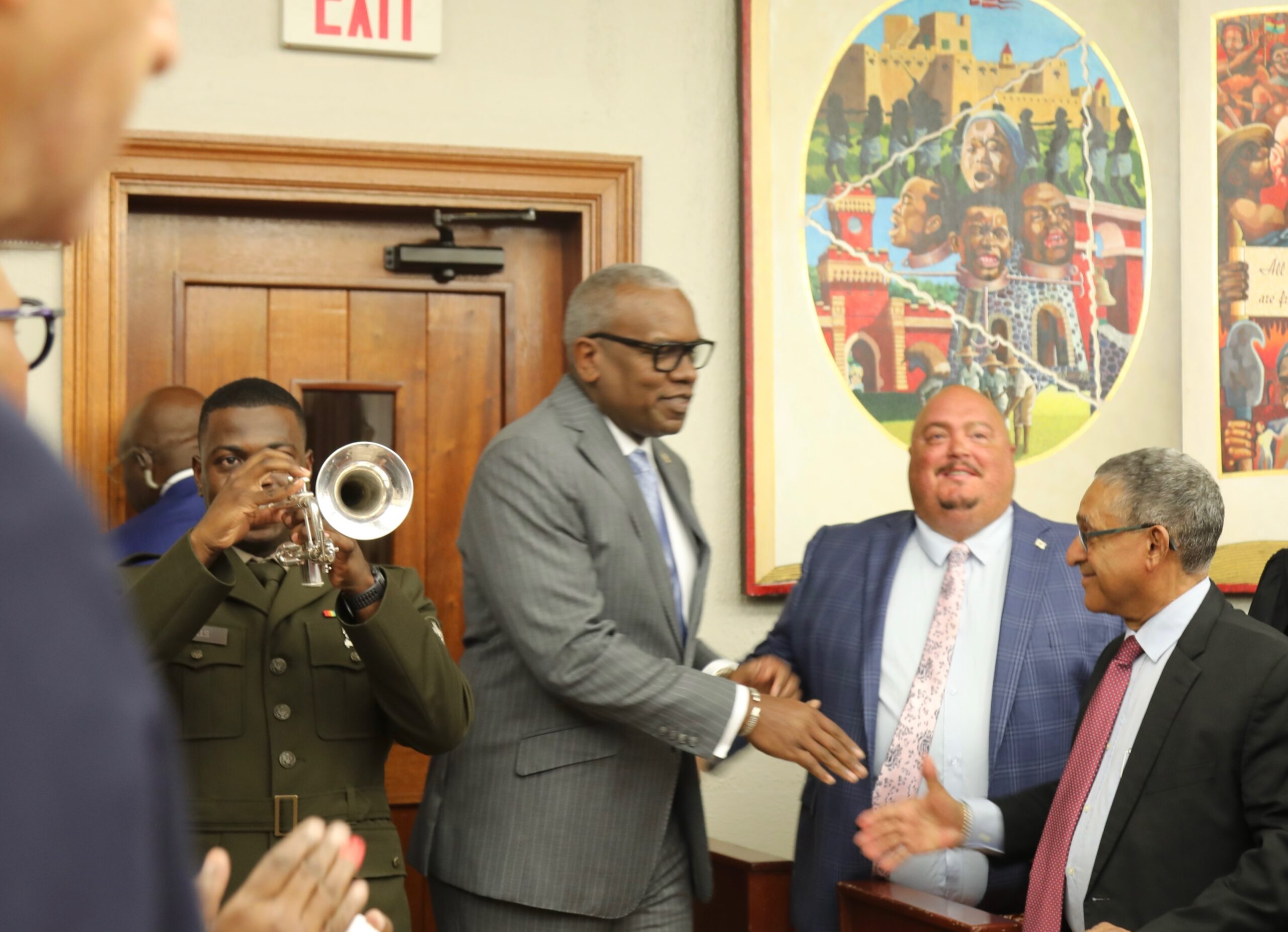 Brett "Mac" McClafferty, center, greets Gov. Albert Bryan Jr. as he arrives at the Legislature on St. Thomas for the State of the Territory address Jan. 26, almost a month after an arrest warrant had been issued for McClafferty's arrest on grand larceny charges. (Source file photo by Ananta Pancham)