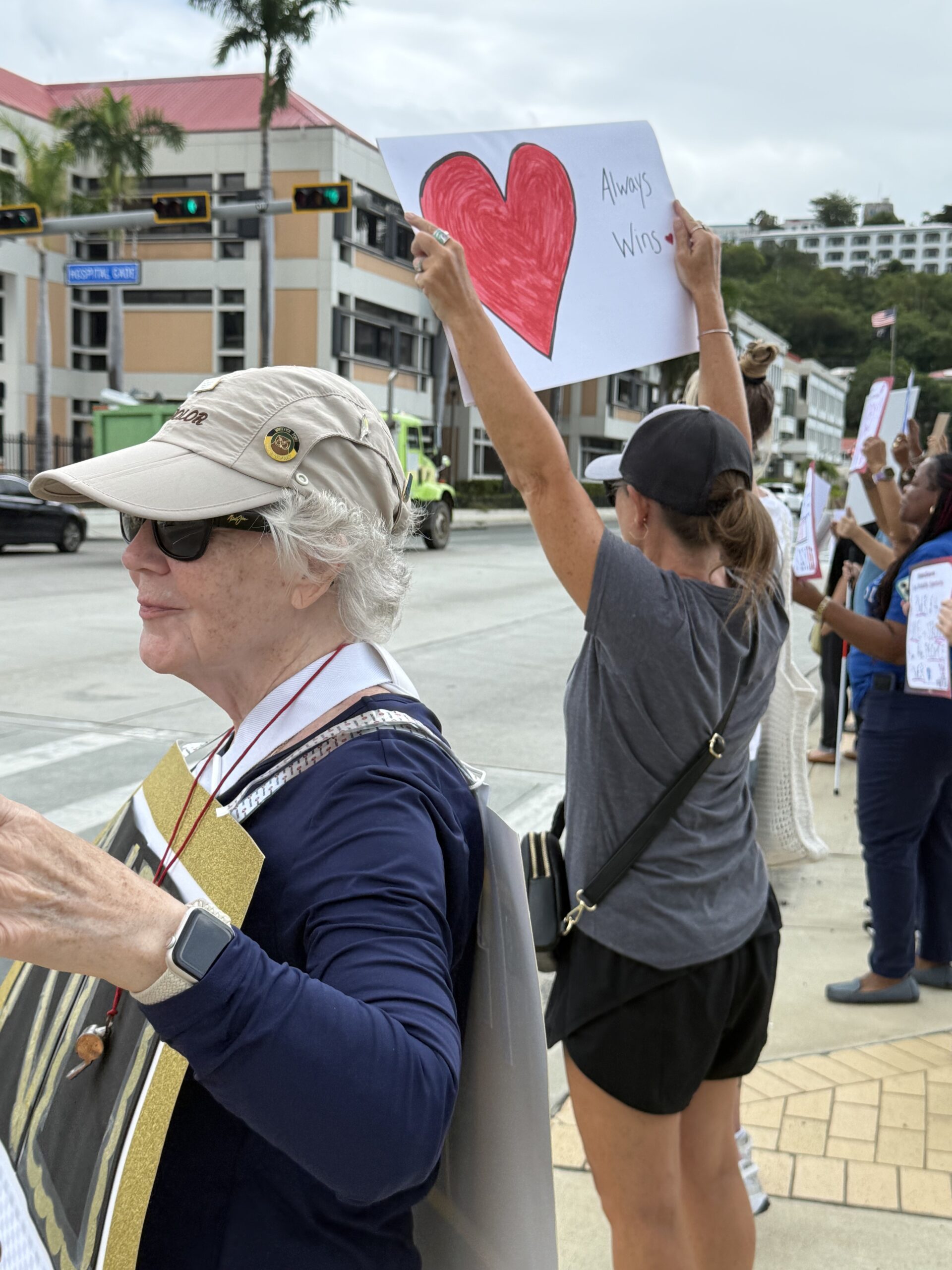 Protestors hold their signs high at the No Kings rally Saturday on St. Thomas. (Photo courtesy Jane Higgins)