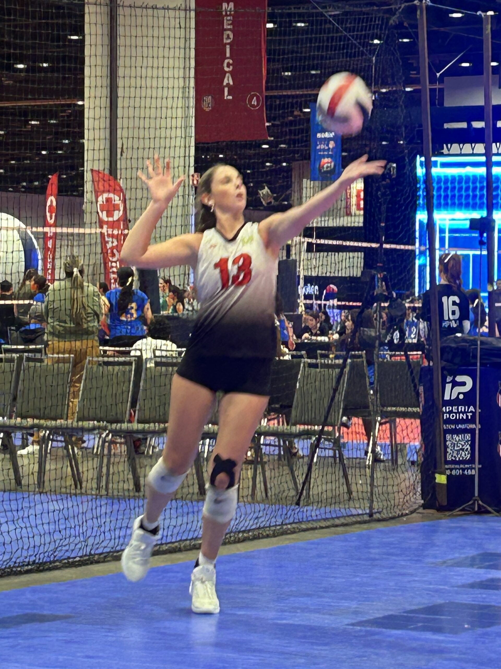 #13 Kiera McNally of Island Mixx 16-1 serves one of her nine straight points to seal the victory over Sideout 15/16 Navy at the 2026 AAU National Volleyball Championships. (Photo by Mark J. Daniel)