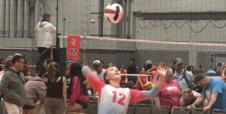 Scarlett Poss (Island Mixx 13U) serves the ball during their match against Dunes 13 Teal. (Photo by Mark Daniel)